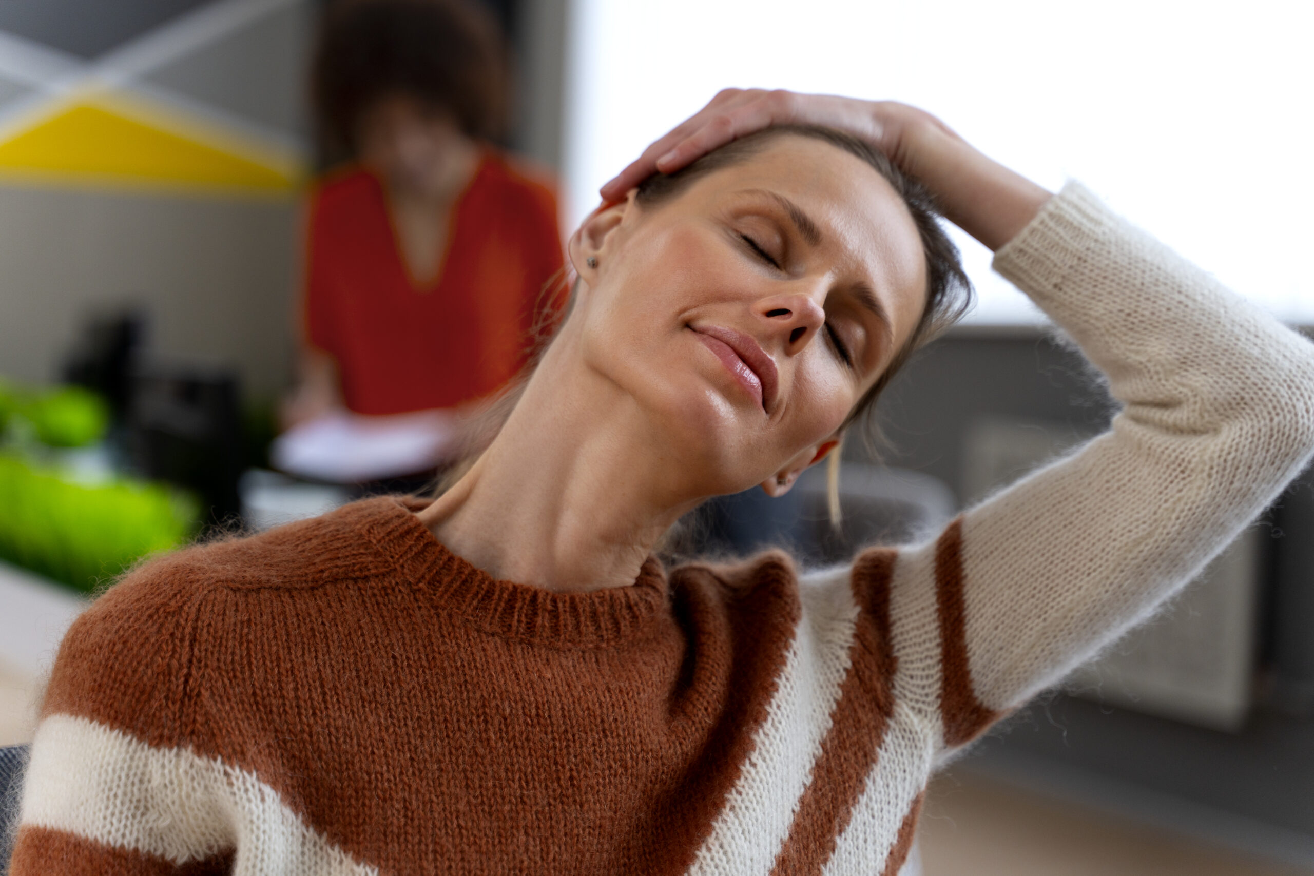 woman-office-stretching-work-day